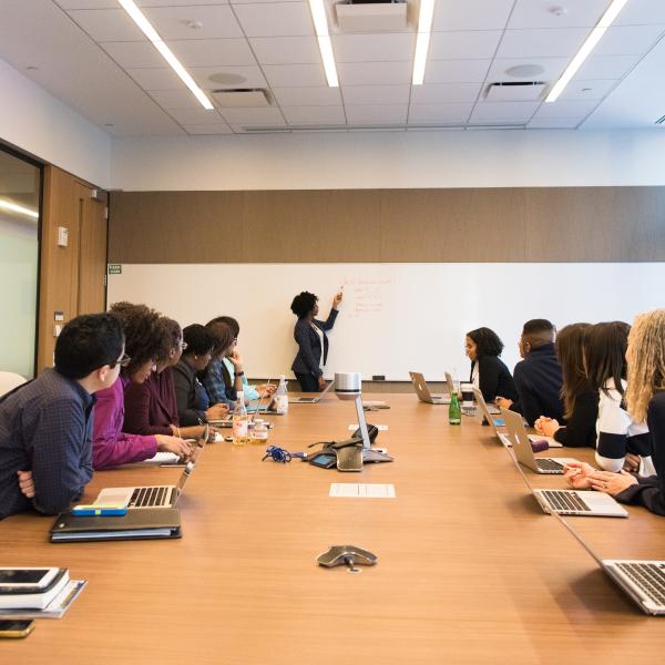 Women sitting around a board table