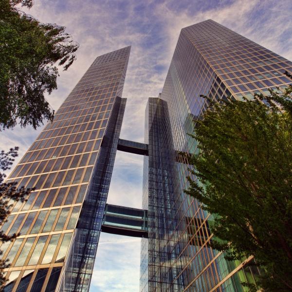 a view of an office tower from the ground