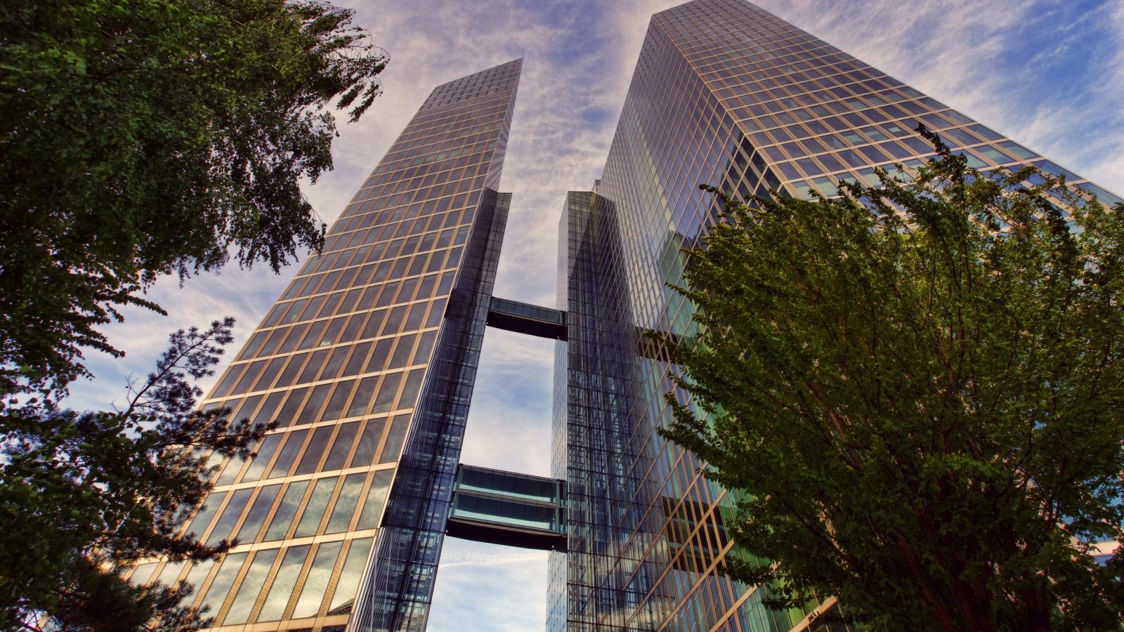 a view of an office tower from the ground